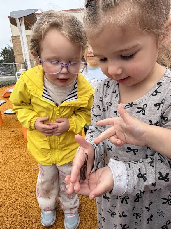 Tots holding worms