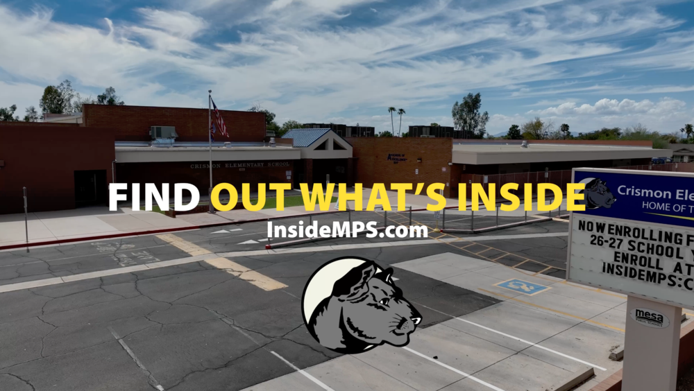An drone shot of a school with the words "Find Out What's Inside" InsideMPS.com and a graphic of a cougar logo in the front.
