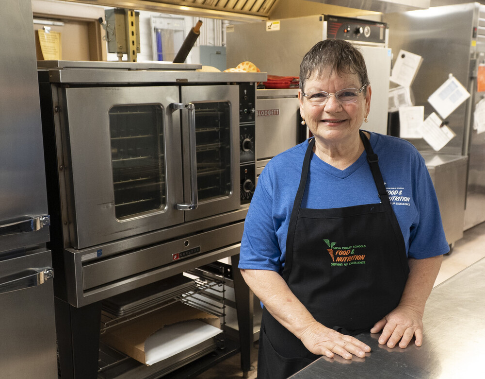 Smiling female cafeteria worker.