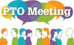 people talking in groups at a meeting
