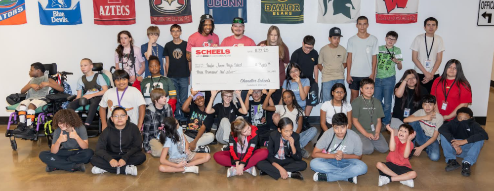 Picture of Students and donation check from scheels