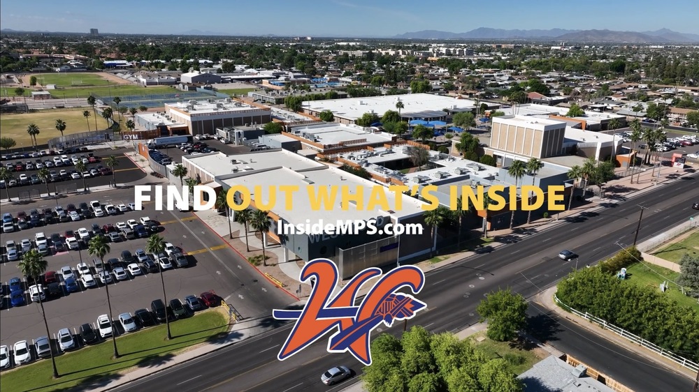 Aerial view of school campus with graphic that says Find out what's inside