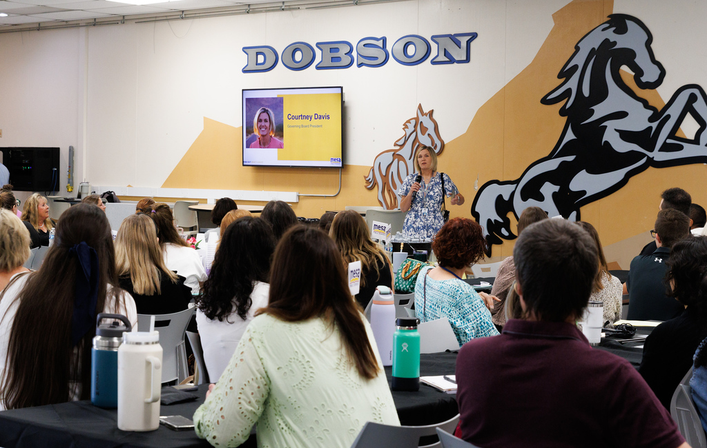 Governing Board president Courtney Davis addressing new teachers to Mesa
