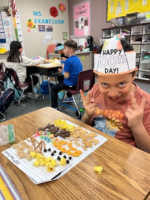 student with counted food items to equal 100