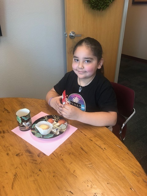 student at a tea party