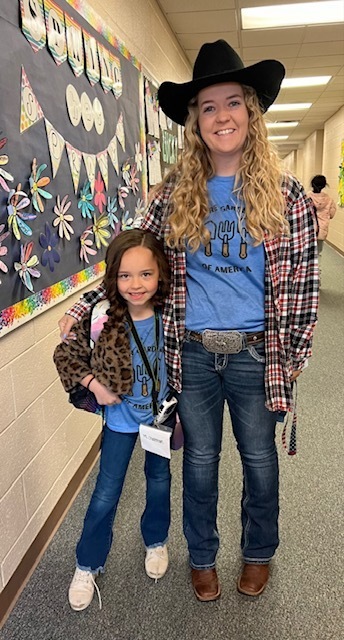 teacher and child dressed in matching cowboy clothes