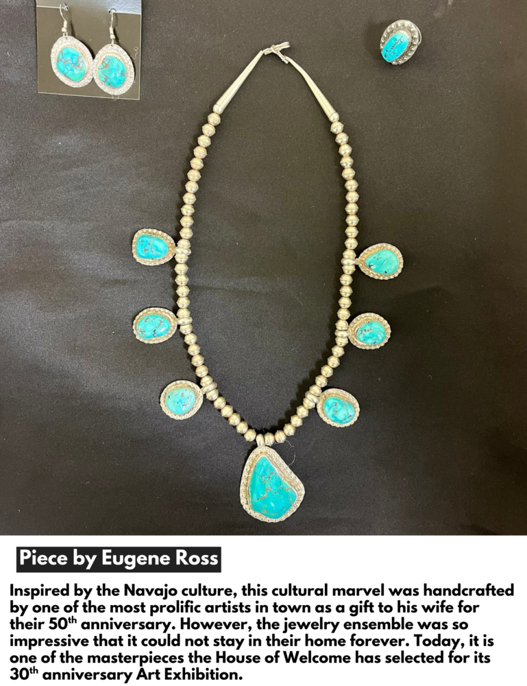 A jewelry ensemble with a necklace, ring and earings