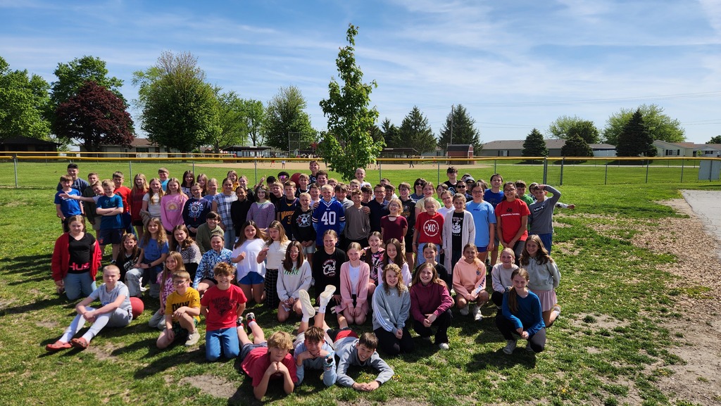 5th graders with one of their trees