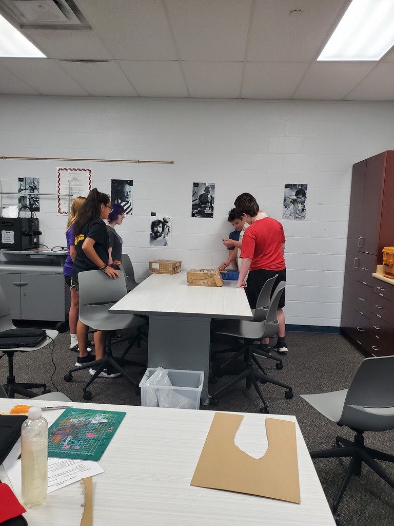 PLTW students using Chomp Saws