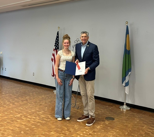 Lizzie Joes receiving her Runner-Up award from Rep. Darrin LaHood at the Peoria Riverfront museum on Saturday.
