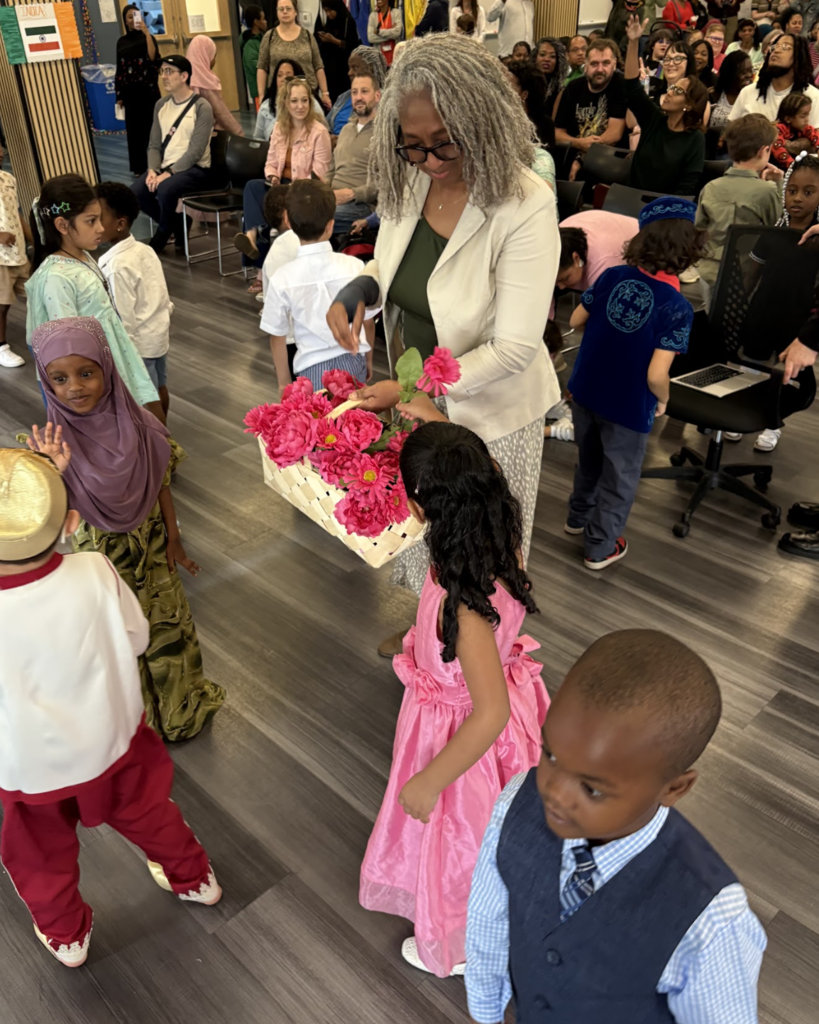Students presenting flowers