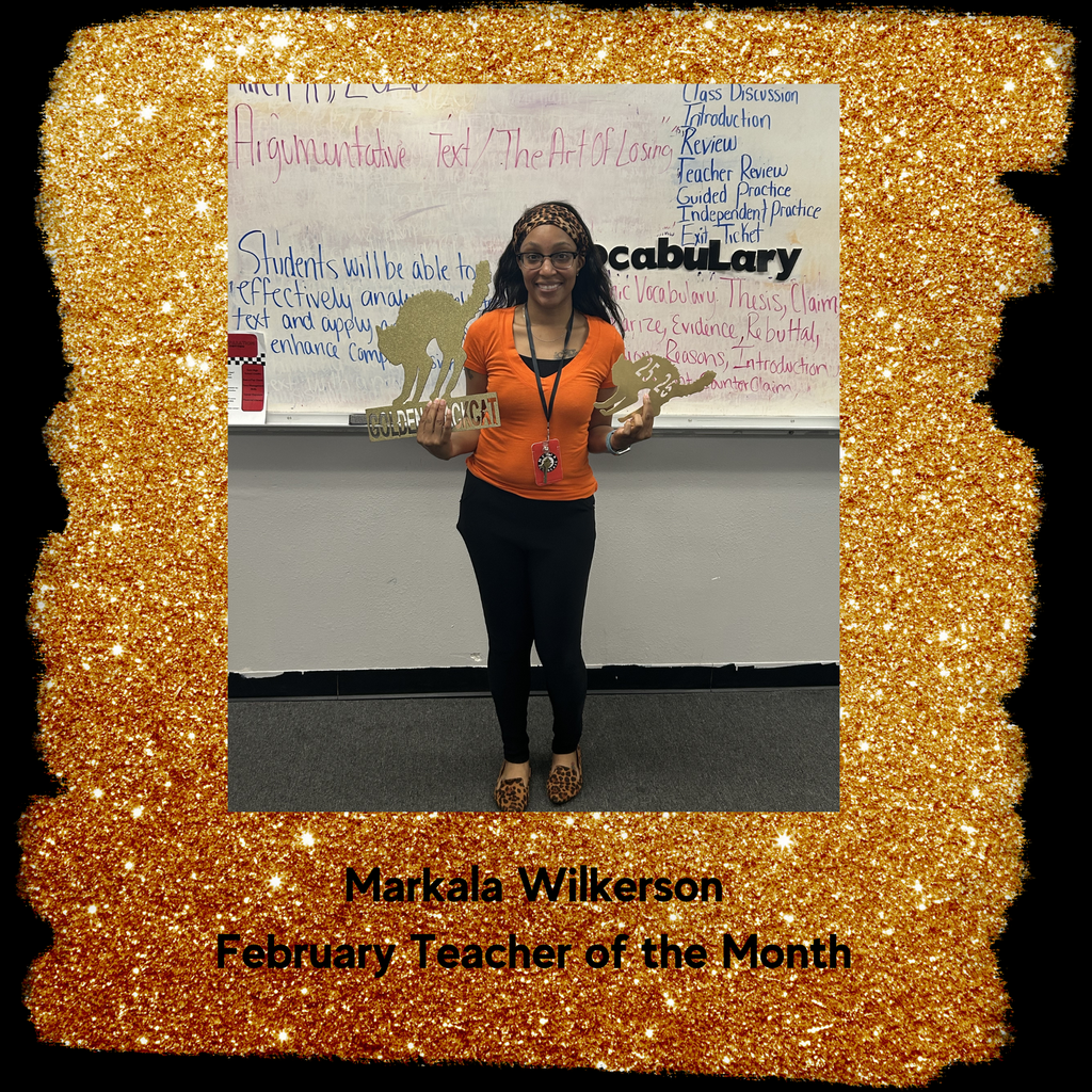 a female teacher posing with golden blackcat award