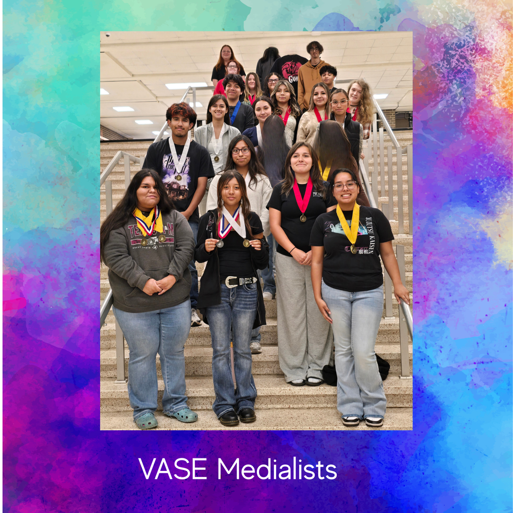 group of students posing on staircase showing off their medals
