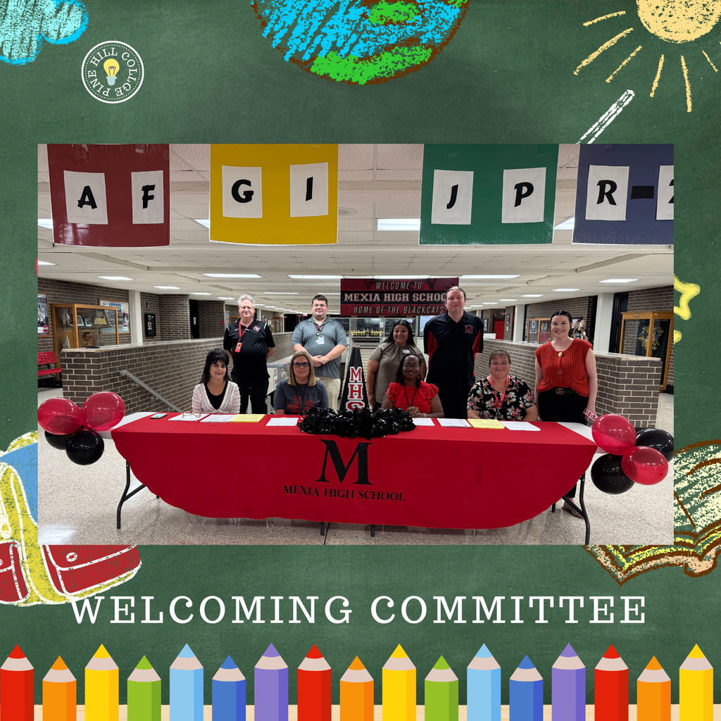 Welcoming Committee at Mexia High School, seated behind a table, with balloons and letters above.