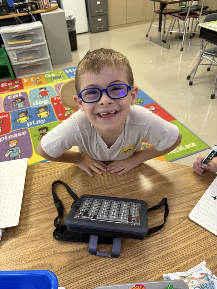 Miami East kiddos using UFLI for phonics/reading instruction and AAC device.