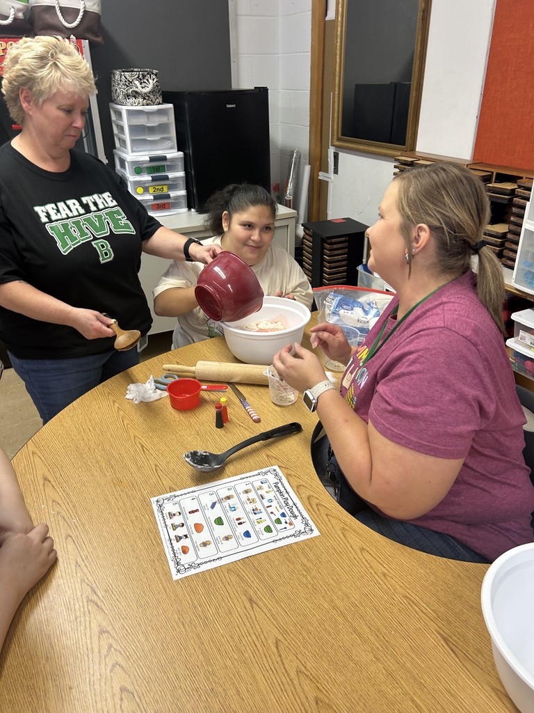 Ms. Hinkle’s class made playdoh during cooking. We used measuring cups to measure flour, oil, and water. We mixed red and yellow food coloring to make it orange like a pumpkin.