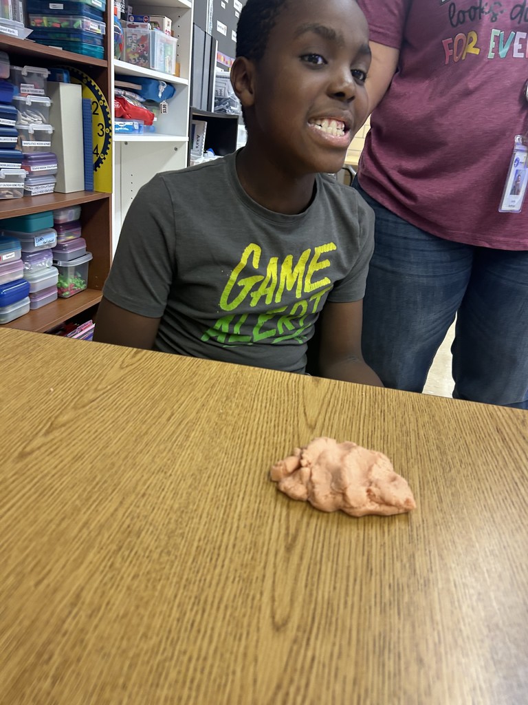 Ms. Hinkle’s class made playdoh during cooking. We used measuring cups to measure flour, oil, and water. We mixed red and yellow food coloring to make it orange like a pumpkin.