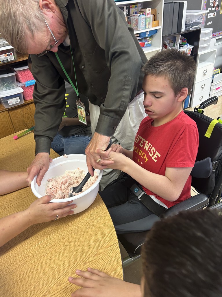 Ms. Hinkle’s class made playdoh during cooking. We used measuring cups to measure flour, oil, and water. We mixed red and yellow food coloring to make it orange like a pumpkin.