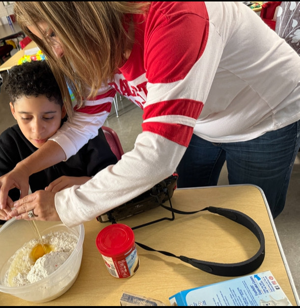 Mrs. Durbin’s class enjoyed learning about a hot air balloon festival last week. They did a science experiment with a plastic grocery bag and a hairdryer to learn how a hot air balloon flies, and they did a hot air balloon craft to help decorate their classroom. They ended the week baking a cake to celebrate two birthdays!