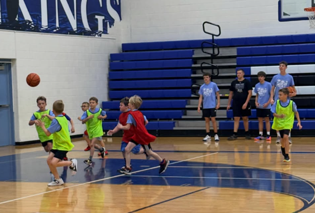 boys playing basketbalkl