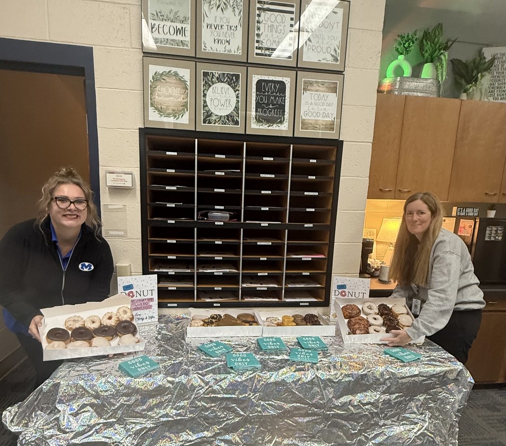 Kim & Hillary setting up donuts