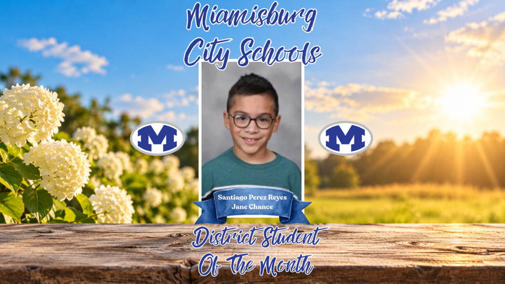 Child in glasses smiles, standing before field of white flowers. Wooden frame displays "District Student of the Month".