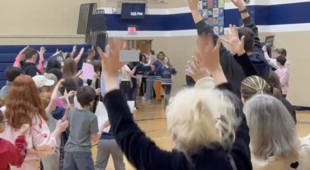 crowd applauding AB team in the gym