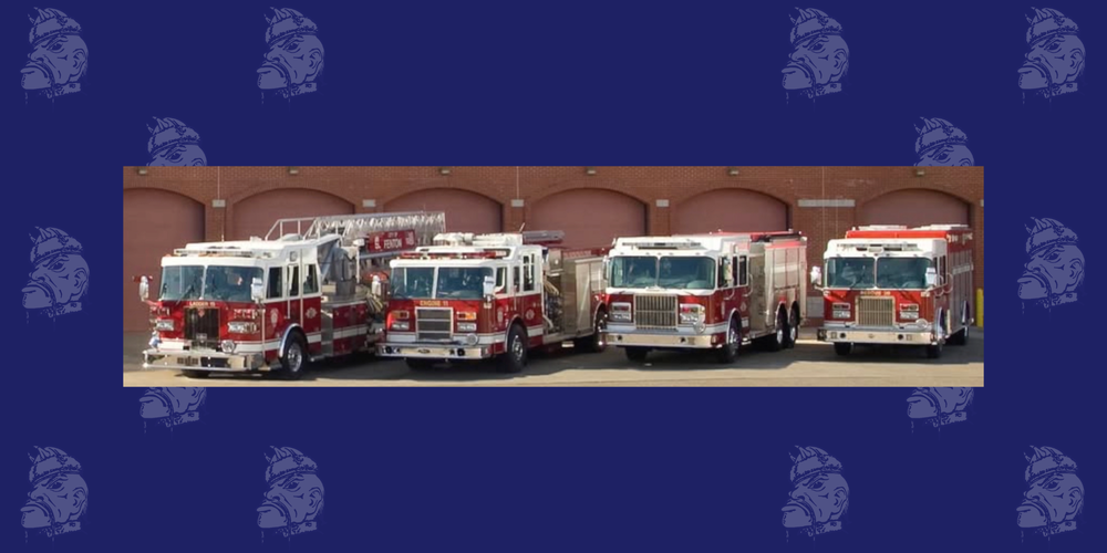 Navy blue tartars background. Row of firetrucks