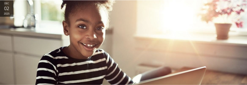 Girl smiling on computer