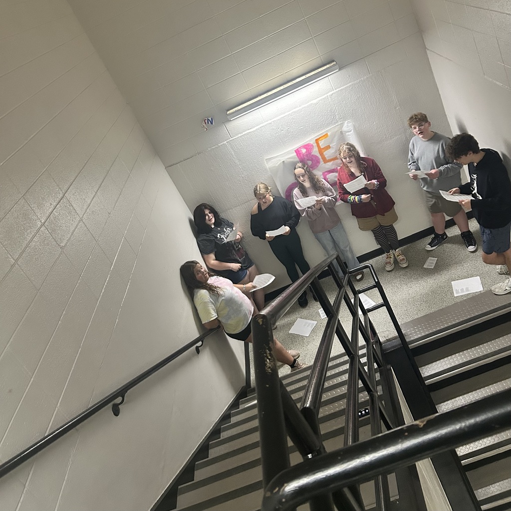 Junior high choir in the stairwell.