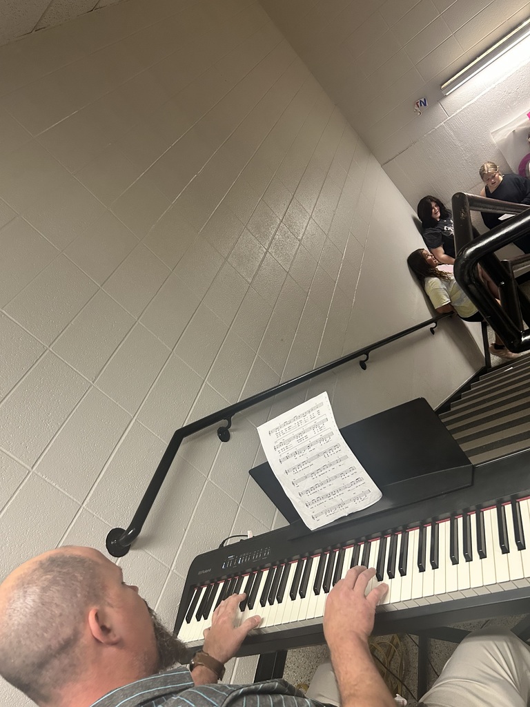 Junior high choir in the stairwell.