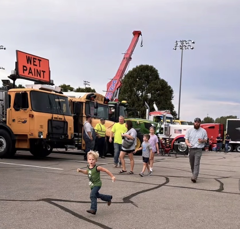 Family exploring trucks
