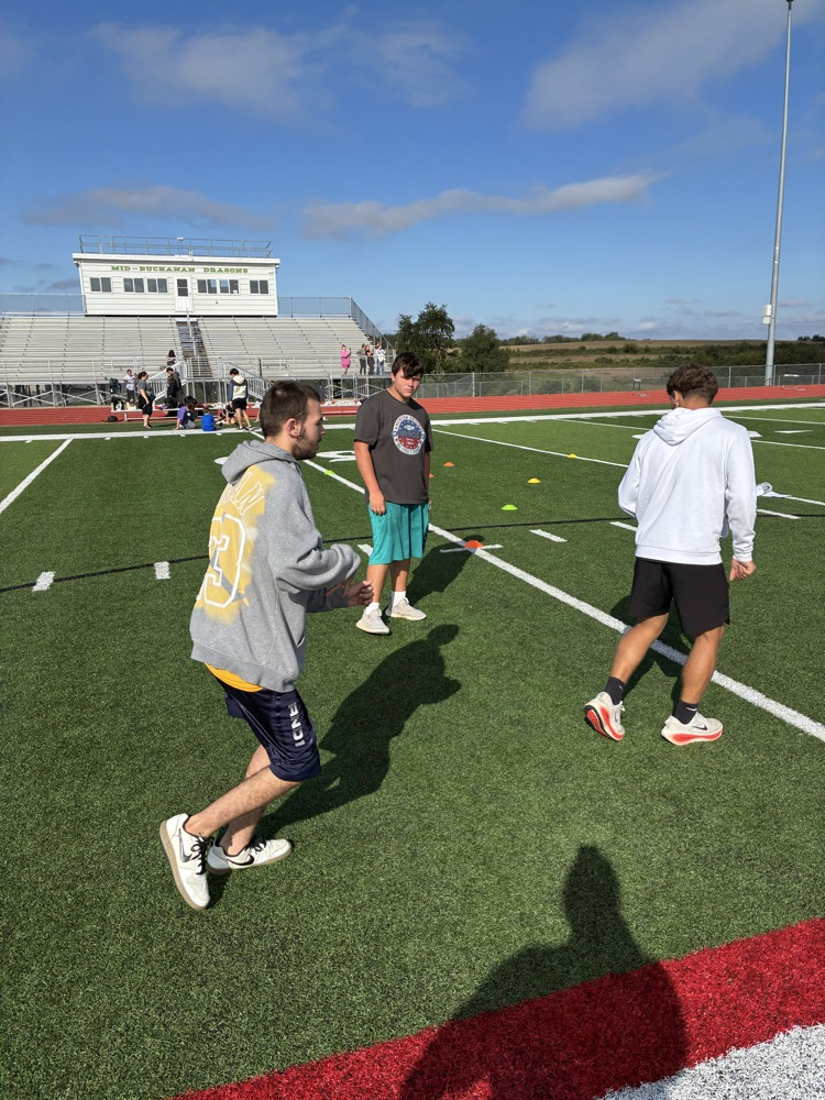 students playing football