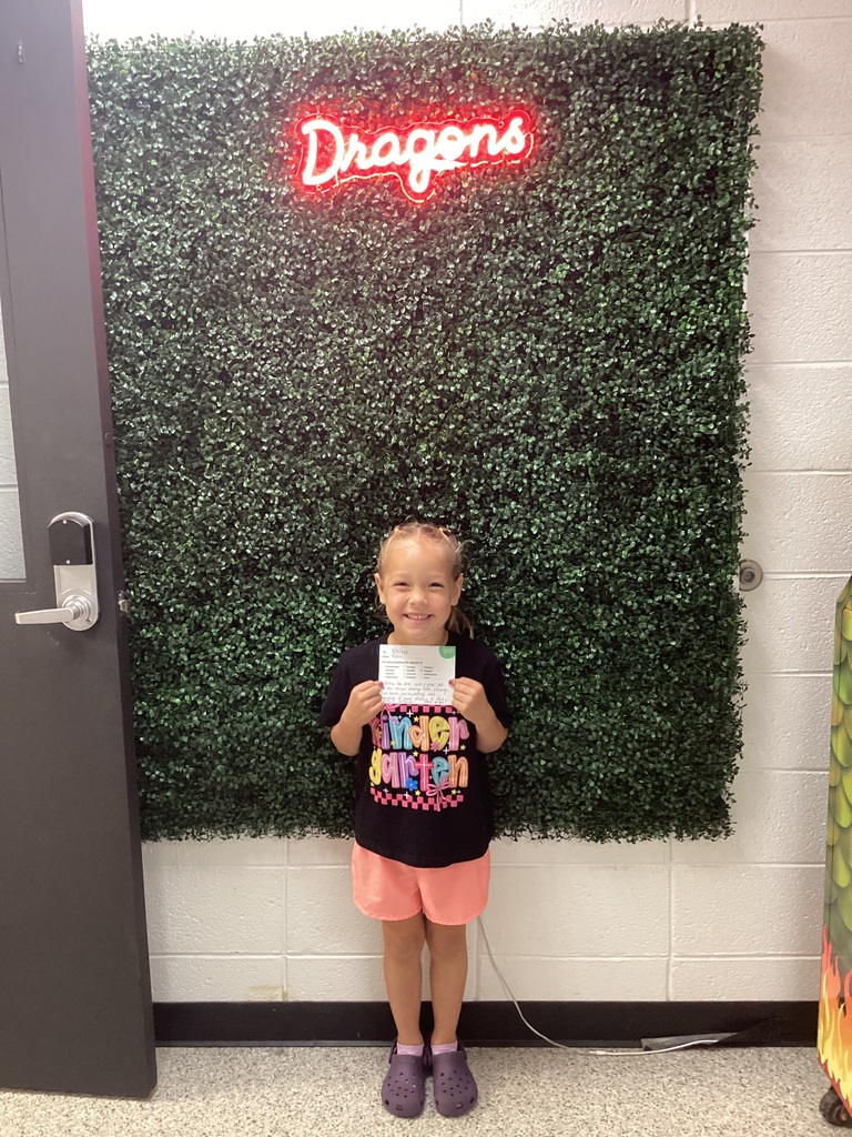 A girl holding heraward
