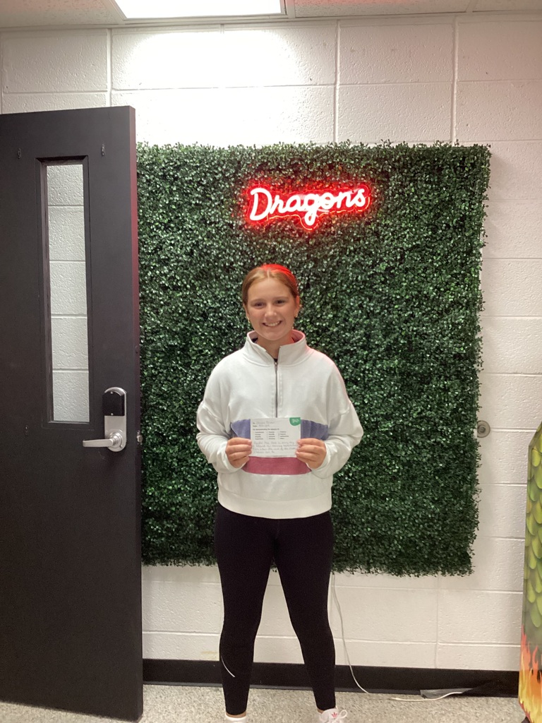 A girl showing her award