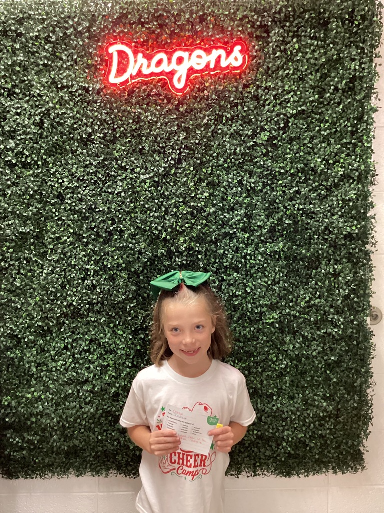 A girl showing her award