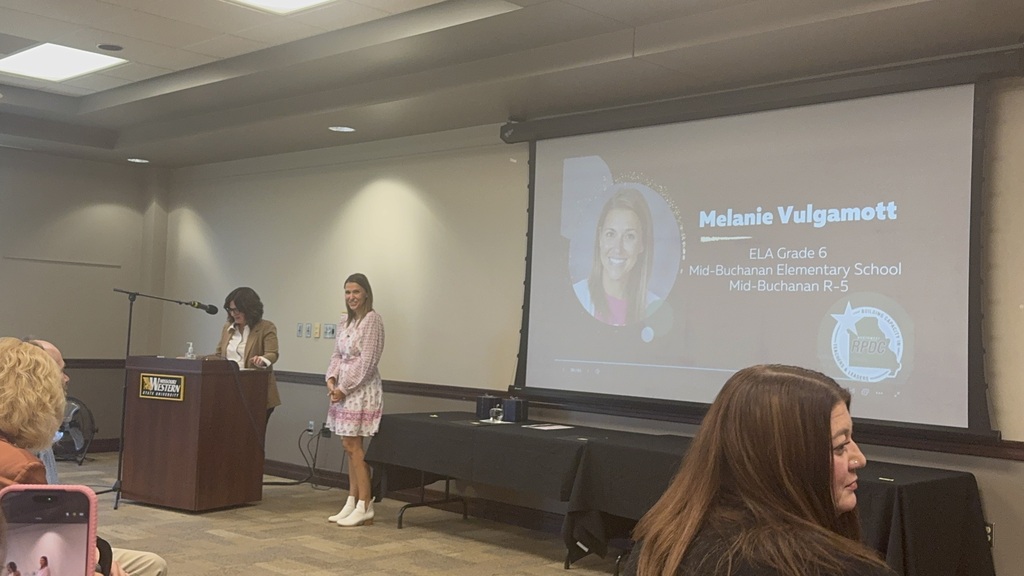 Melanie Vulgamott being recognized by Jenee Gregory