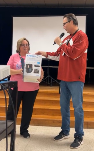 Image of Mrs. Wood receiving Teacher of the Month award. 