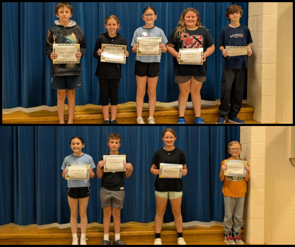 Image of students with their honor roll awards.