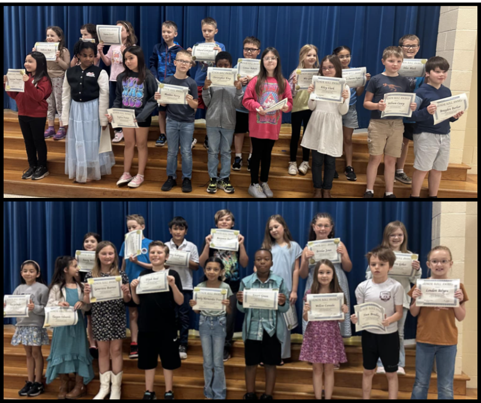 Image of students with their honor roll awards.