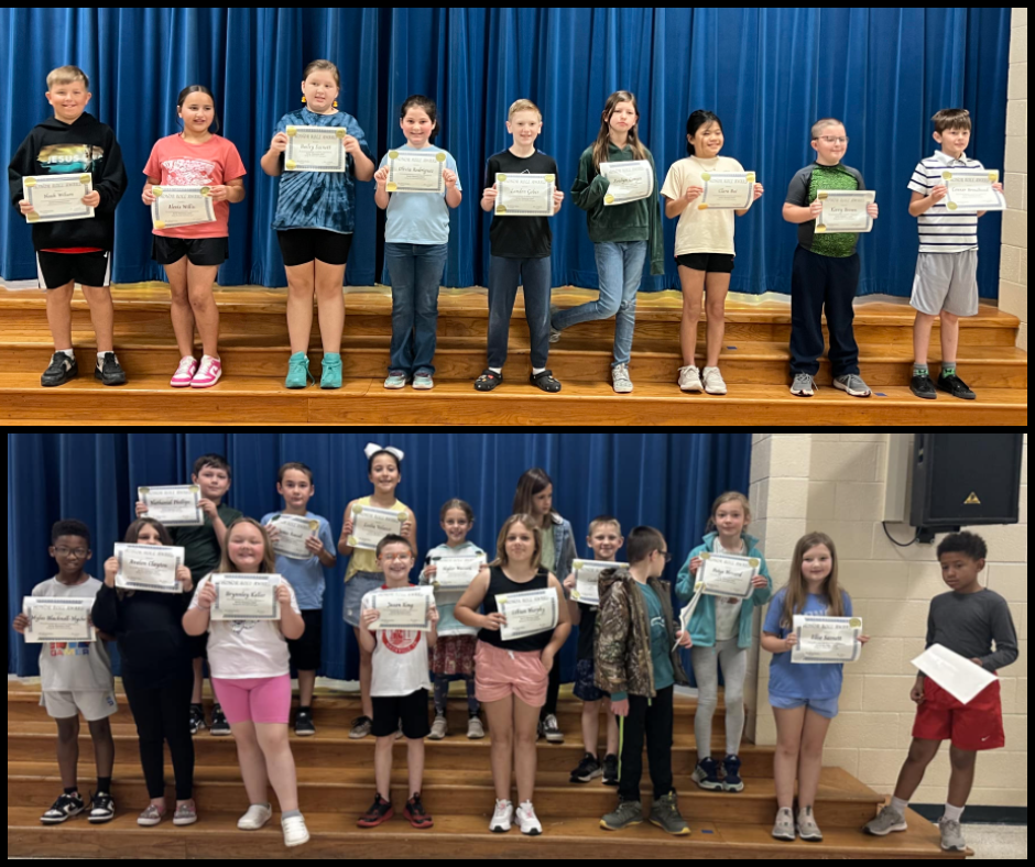 Image of students with their honor roll awards.