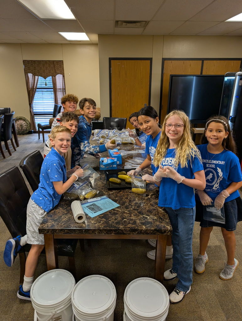 Picture of Student Council students helping with pickles.