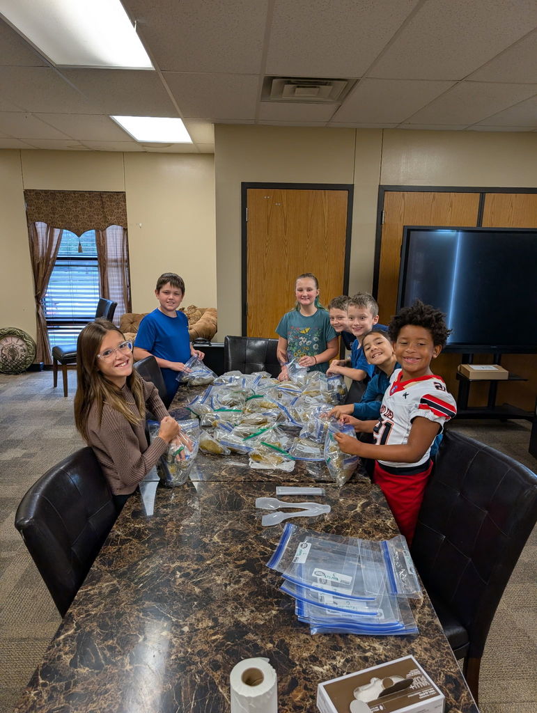 Picture of Student Council students helping with pickles.