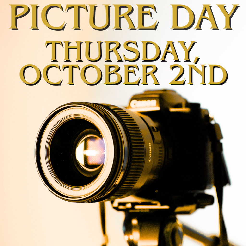 A camera with a bright light reflecting off of it with a golden glow