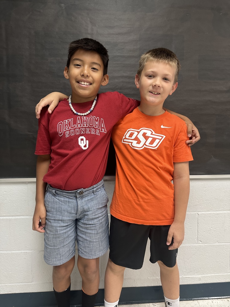 Image of students wearing college and tech shirts.
