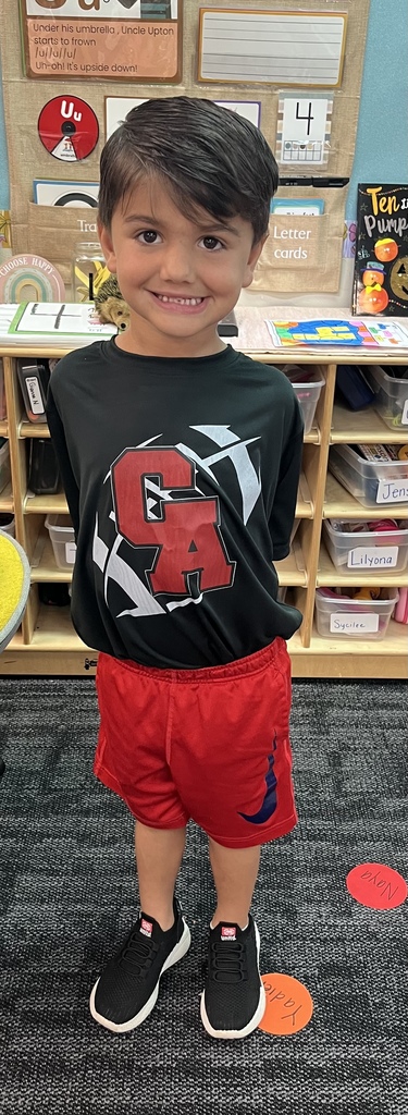 Pictures of students and staff wearing Titan and Mid-Del shirts.