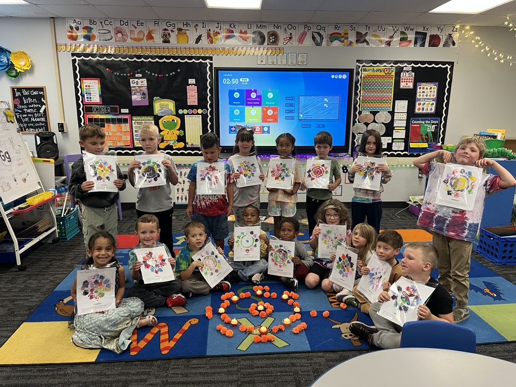 Mrs. Richardson's class showing off their Rangoli's.