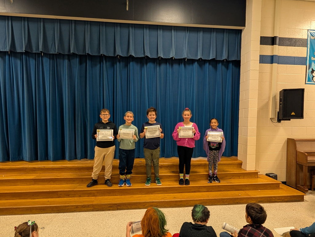 Image of students with their honor roll awards.