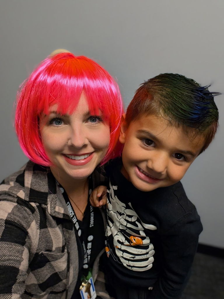 Image of students and staff dressed with crazy clothes and hair.