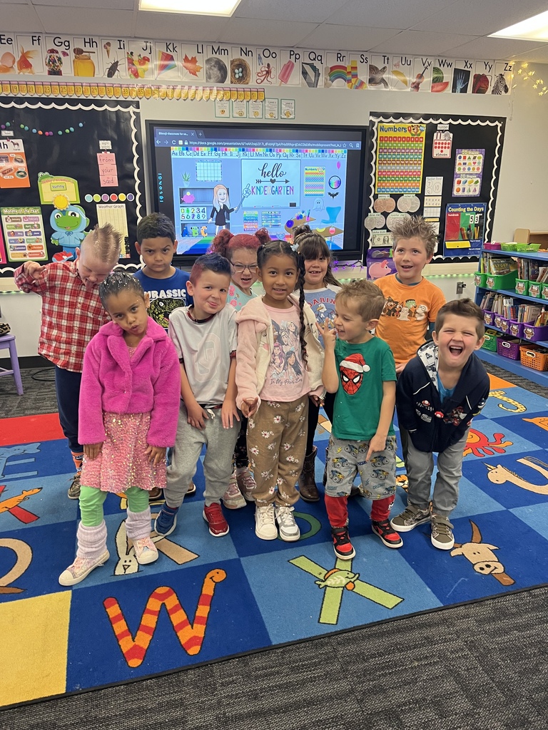 Image of students and staff dressed with crazy clothes and hair.